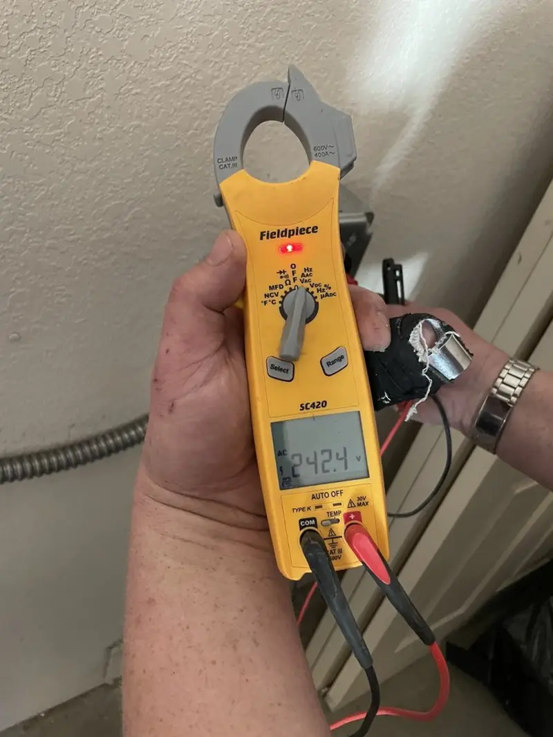Voltage testing with clamp meter during Electrical Installation Services in Freeburg